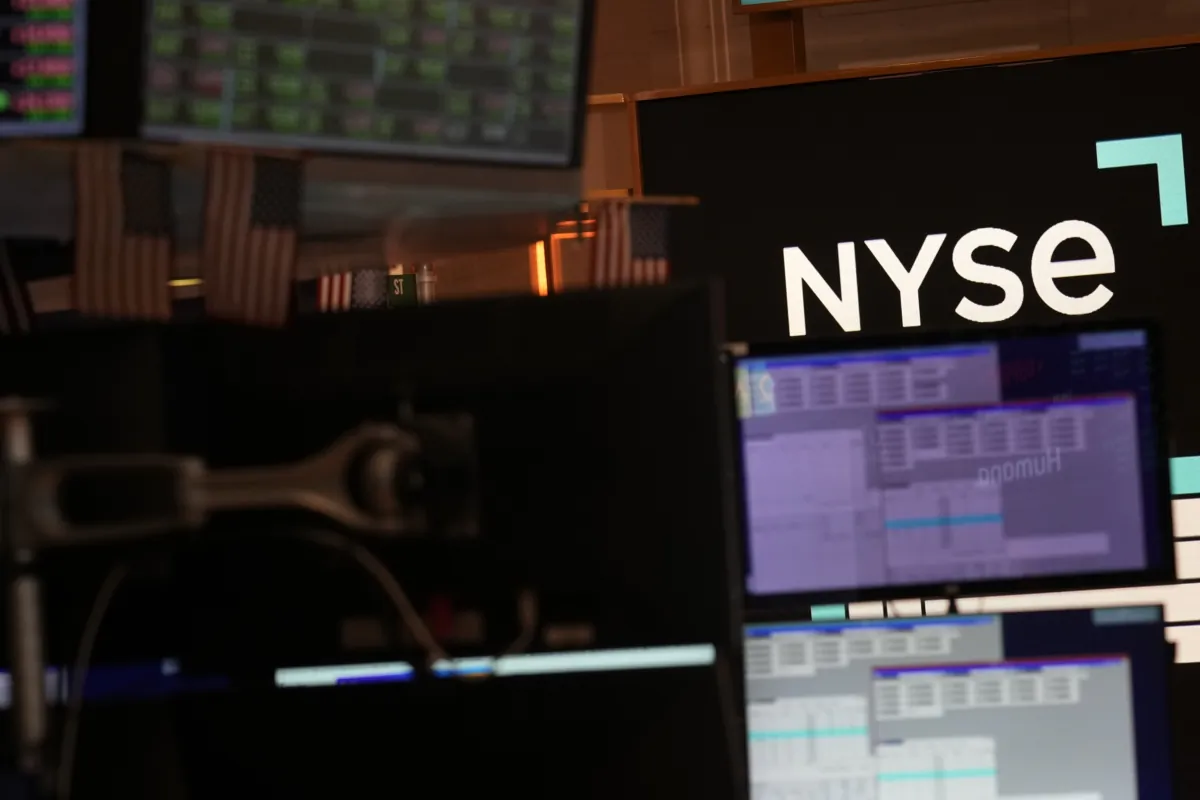 A screen displays the NYSE logo on the floor at the New York Stock Exchange in New York on June 2, 2023. (Seth Wenig/AP Photo)
