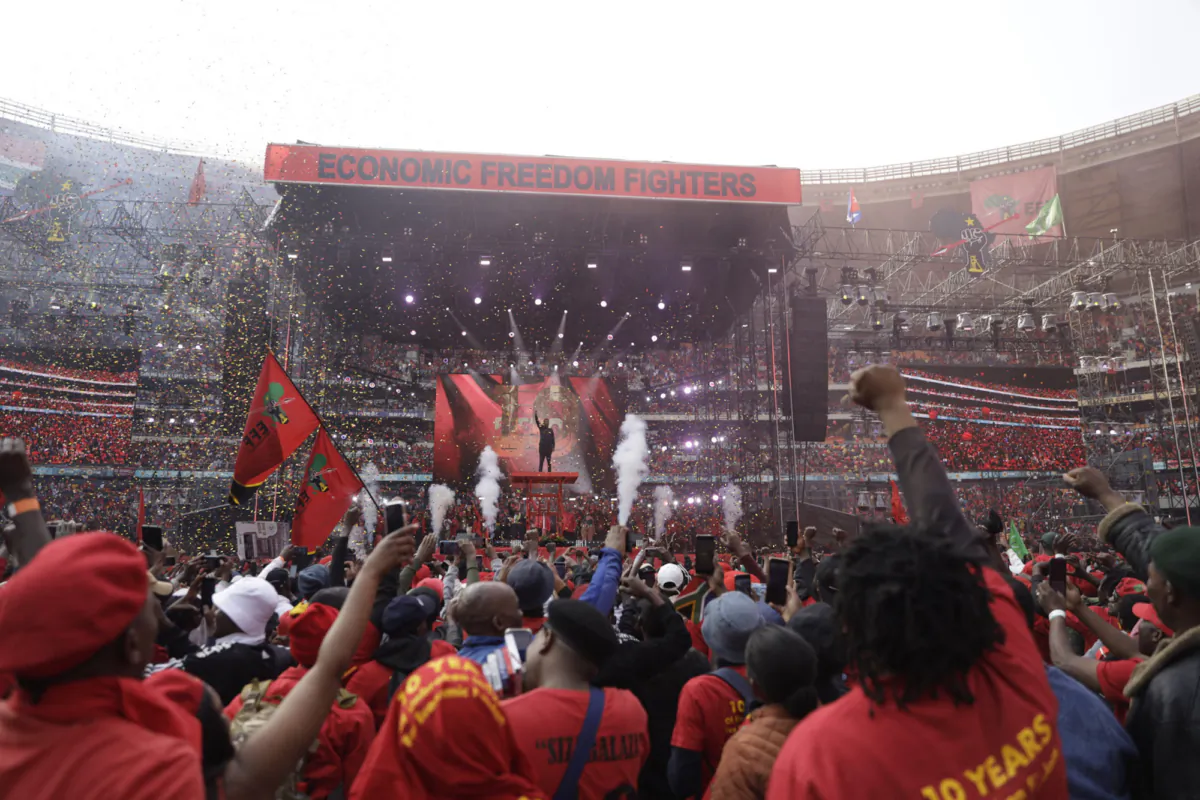 Economic Freedom Fighters (EFF) leader Julius Malema (C) gestures from the stage as he celebrates the 10th anniversary of the party in Johannesburg on July 29, 2023. (Guillem Sartorio/AFP via Getty Images)