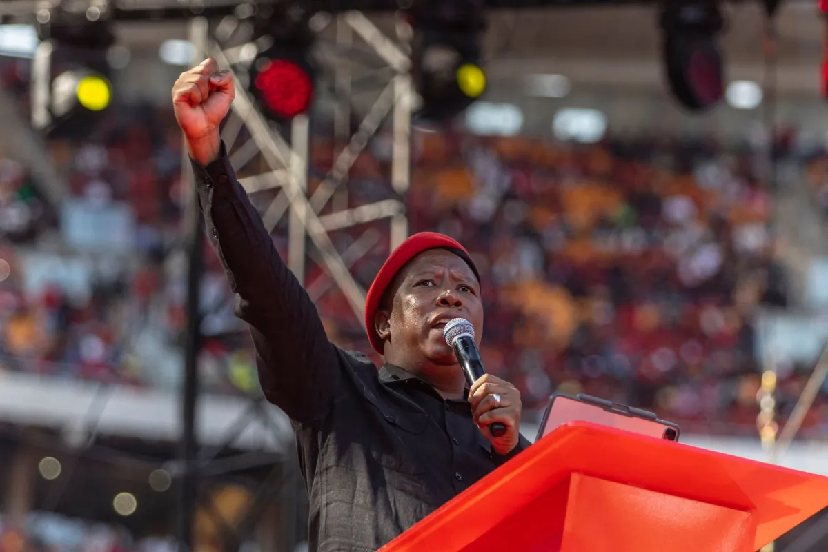 Economic Freedom Fighters leader Julius Malema gestures from the stage as he celebrates the 10th anniversary of the party in Johannesburg on July 29, 2023. (Guillem Sartorio/AFP via Getty Images)