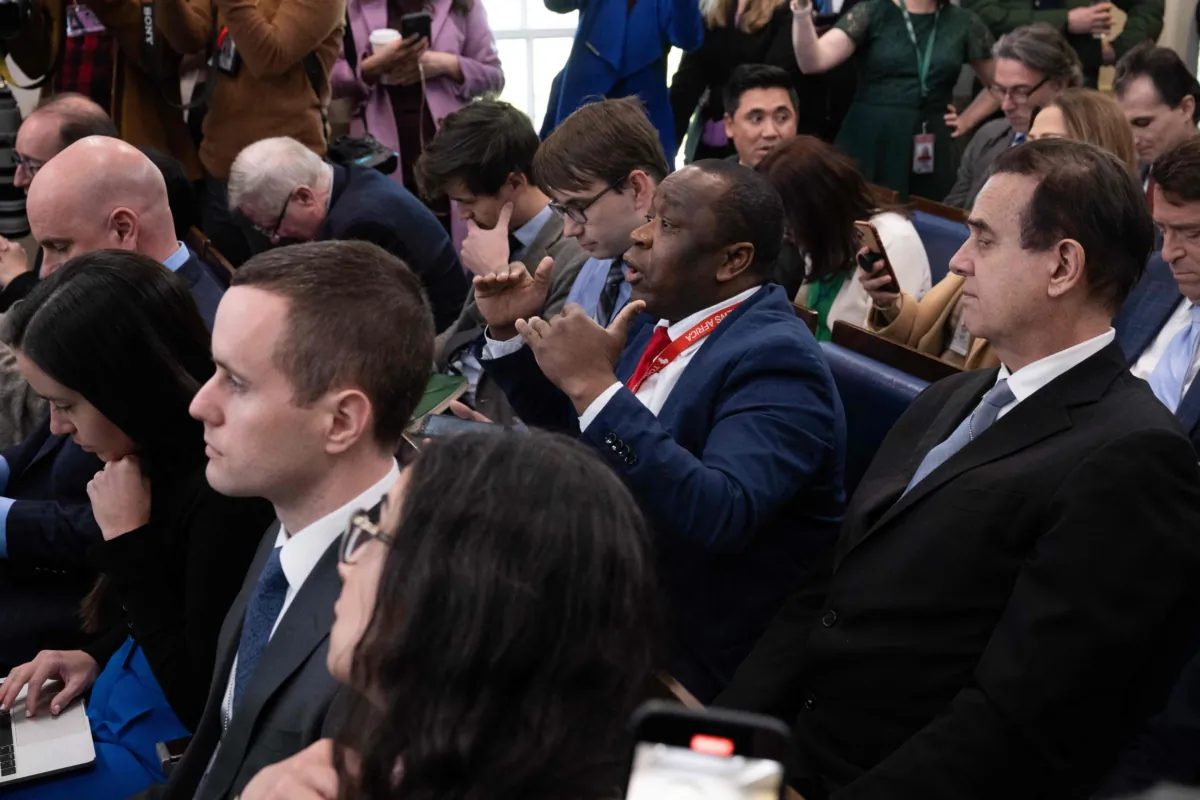 Today News Africa reporter Simon Ateba (C) interrupts as White House press secretary Karine Jean-Pierre (not pictured) begins the daily press briefing in the Brady Press Briefing Room of the White House in Washington on March 20, 2023. (Saul Loeb/AFP via Getty Images)