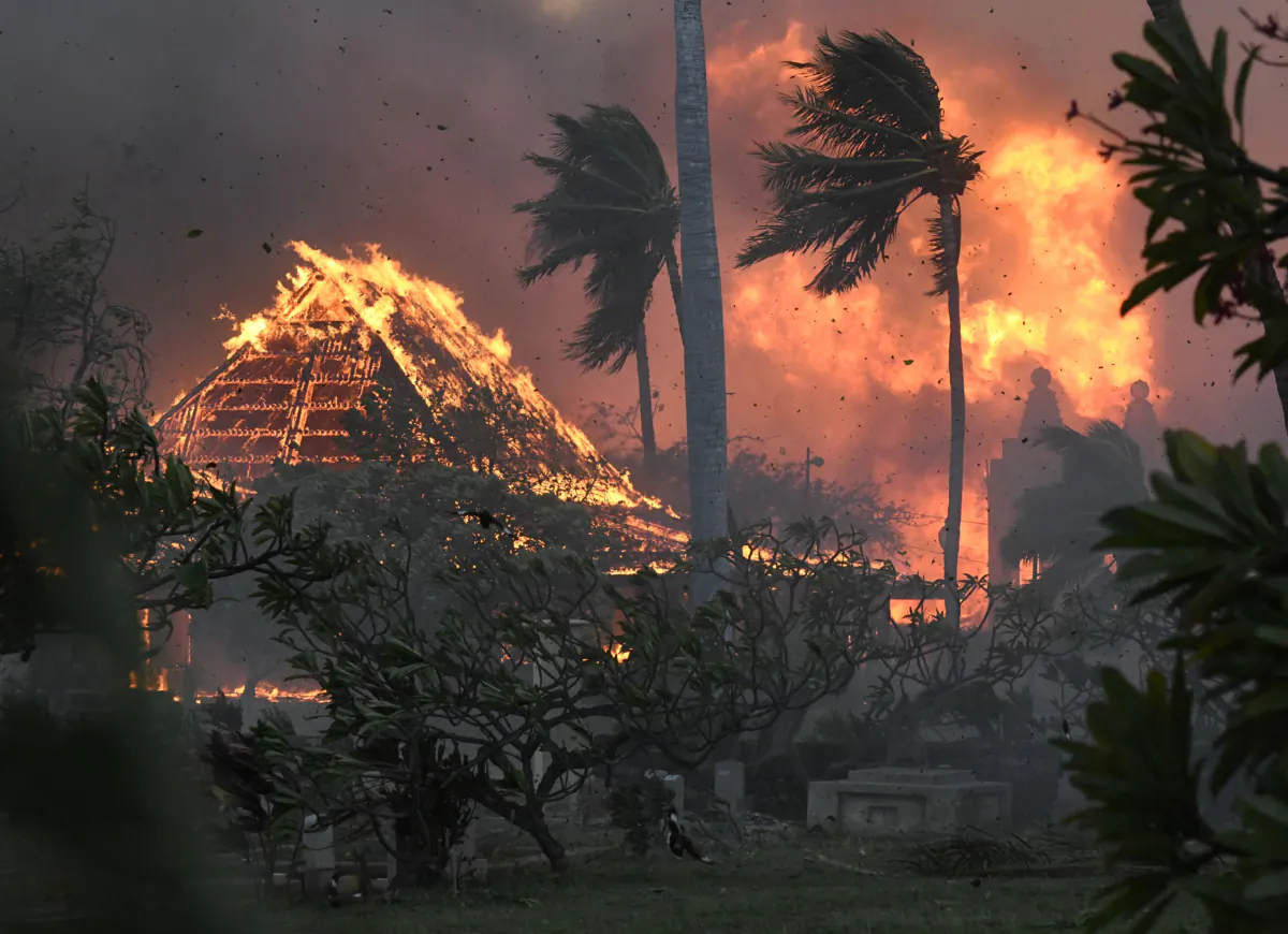 The hall of historic Waiola Church in Lahaina and nearby Lahaina Hongwanji Mission are engulfed in flames along Wainee Street in Lahaina, Hawaii, on Aug. 8, 2023. (Matthew Thayer/The Maui News via AP)