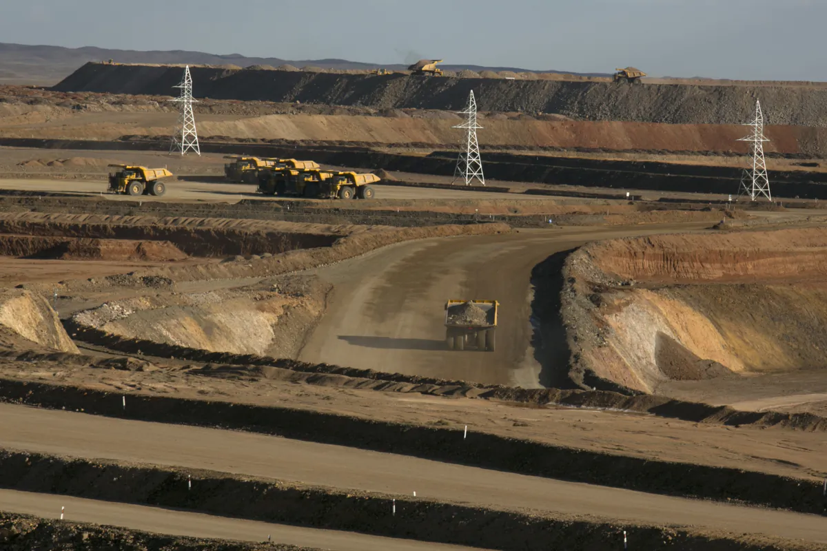 Trucks move tons of ore at the open pit mining area at the Oyu Tolgoi mine in the south Gobi desert, Khanbogd region, Mongolia, on Oct. 11, 2012. (Paula Bronstein/Getty Images)