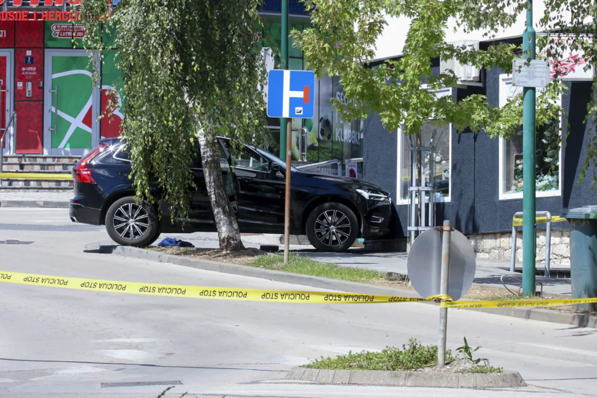 Car is seen on the site of a shooting, in the small Bosnian town of Gradacac, Bosnia, on Aug. 11, 2023. (AP Photo)