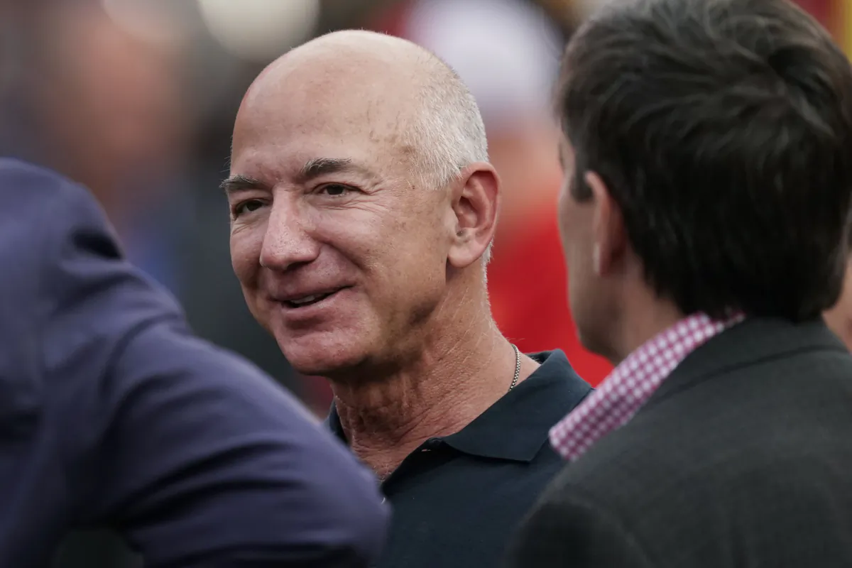 Amazon founder Jeff Bezos is seen on the sidelines before the start of an NFL football game in Kansas City, Mo., on Sept. 15, 2022. (Charlie Riedel/AP Photo)