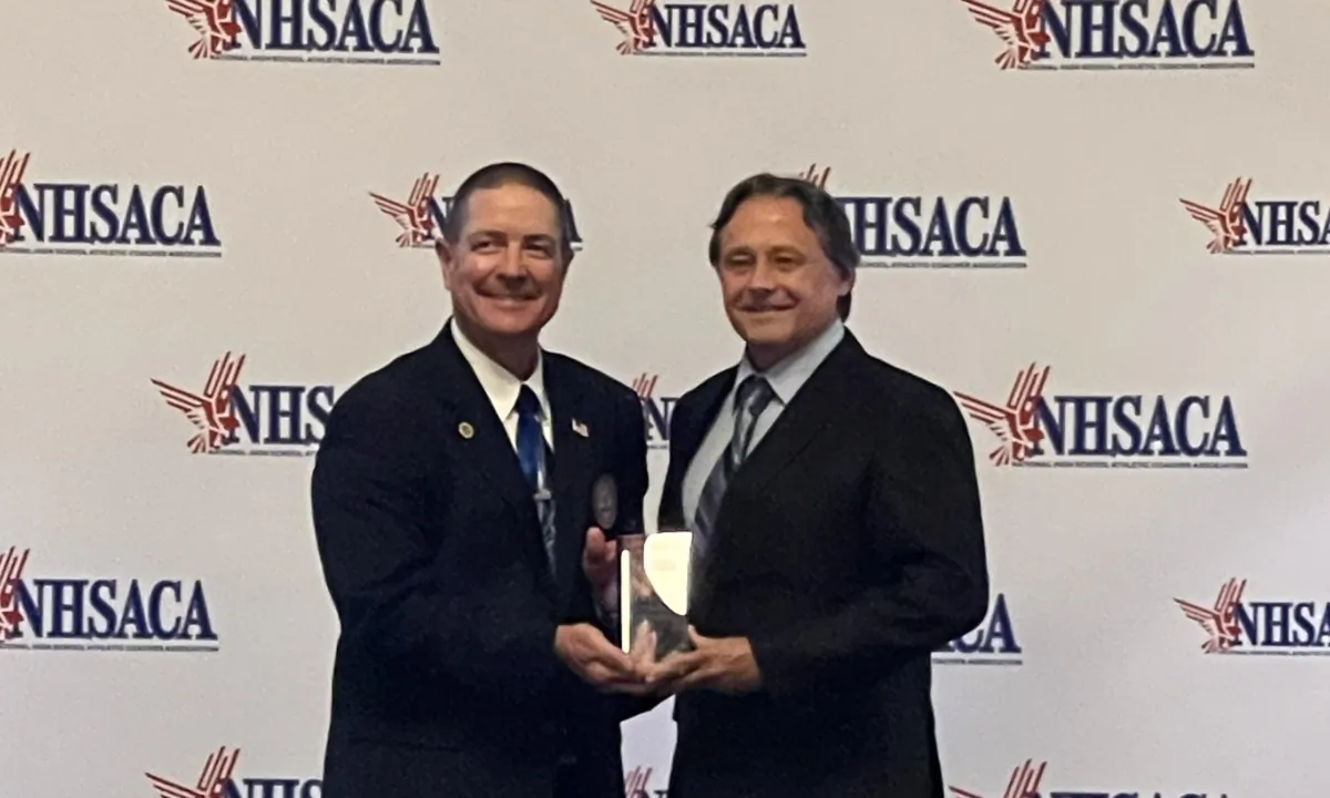 Jeff Gordon (R), retired girls’ soccer coach at Fullerton’s Sunny Hills High School, is honored by the National High School Athletic Coaches Association at its Hall of Fame ceremony at the Historic Haymarket in Lincoln, Neb., on July 25, 2023. (Courtesy of Jeff Gordon)