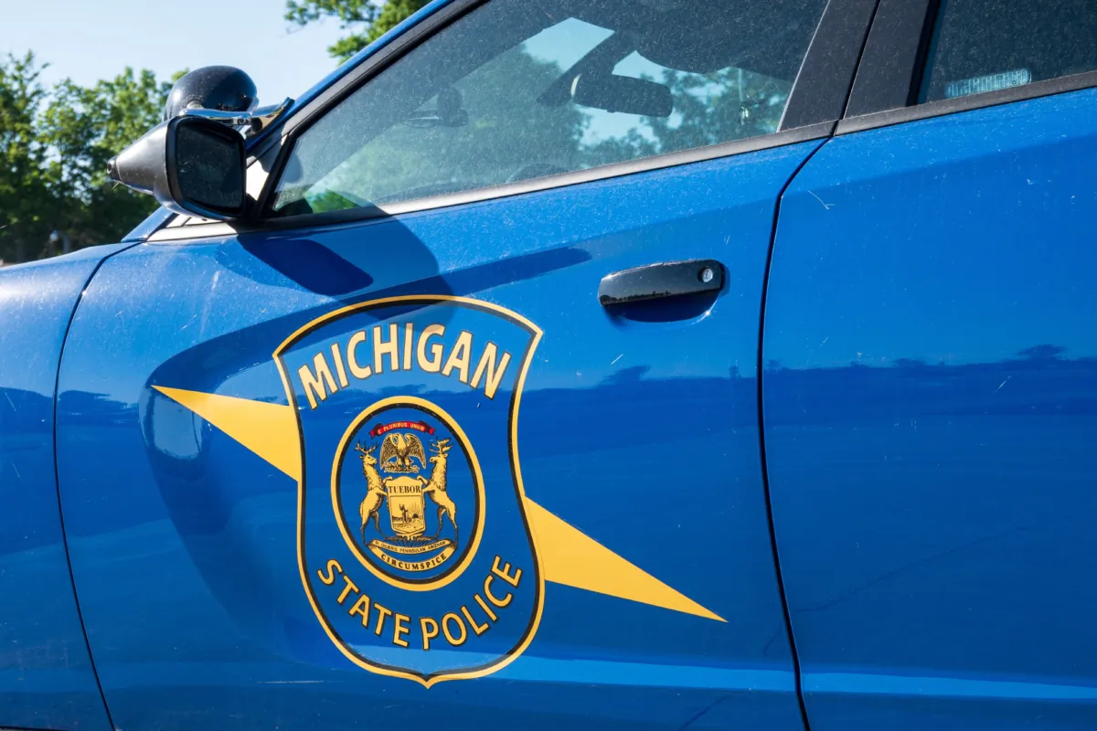 Michigan State Police logo on a squad car in Dimondale, Mich., on June 4, 2022. (Focused Adventures/Shutterstock)