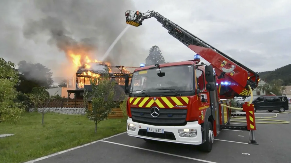 Firefighters try to contain the blaze at a vacation home in the town of Wintzenheim, north-eastern France, on Aug. 9, 2023. (TNN/dpa via AP)