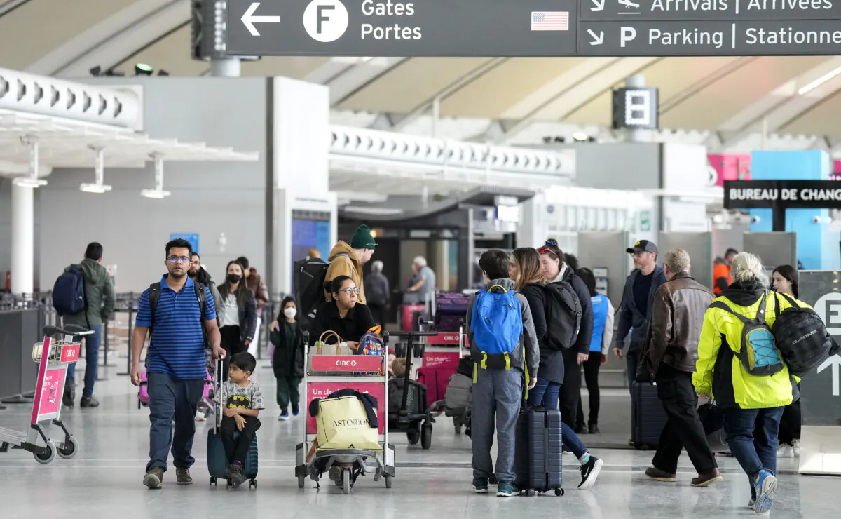 Travellers at Pearson International Airport in Toronto on March 10, 2023. (Nathan Denette/The Canadian Press)