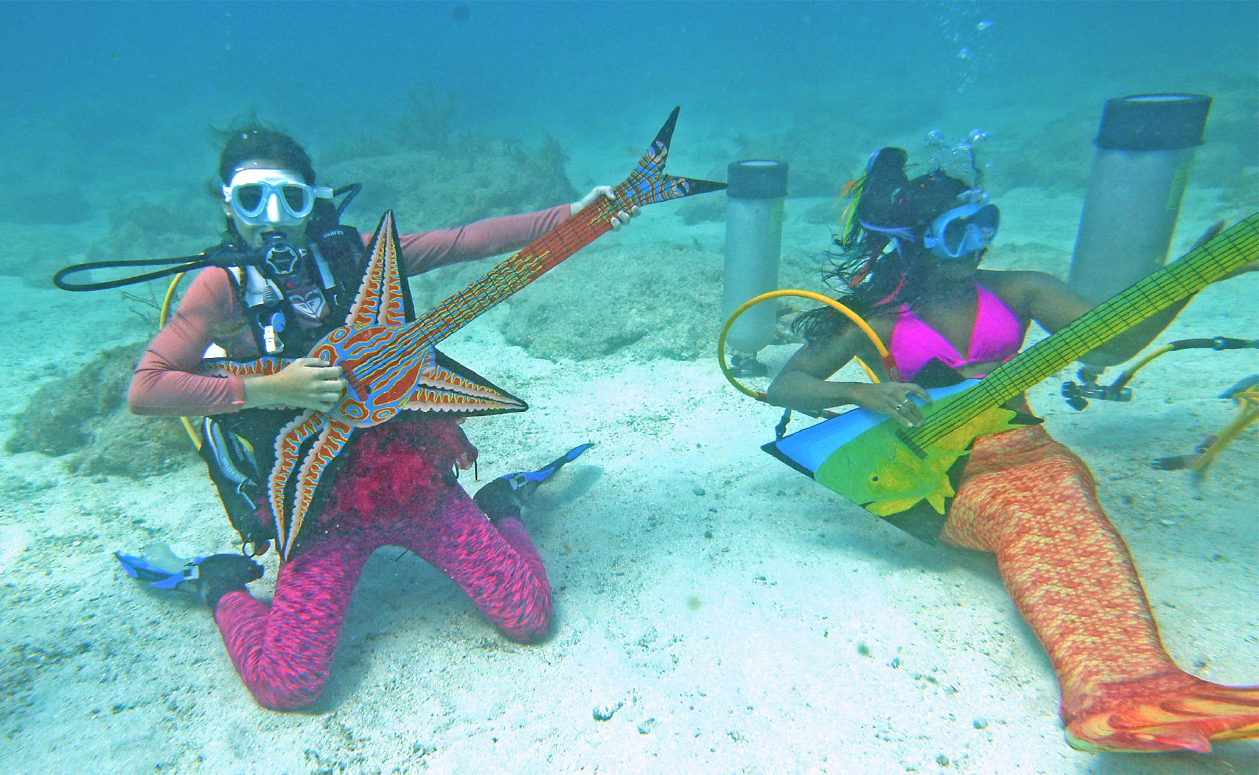 Mermaids and mermen “play” instruments at the Underwater Music Festival in the Florida Keys.