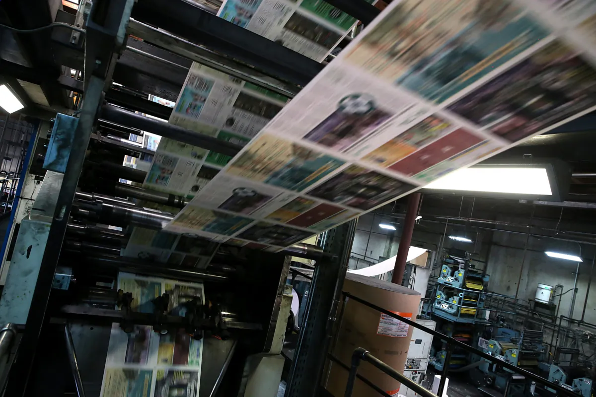 Copies of the new SF Evergreen, the San Francisco Bay Area's first marijuana-themed monthly newspaper, roll through the press at the San Francisco Newspaper Printing Company in San Francisco, California, on Jan. 22, 2015. (Justin Sullivan/Getty Images)
