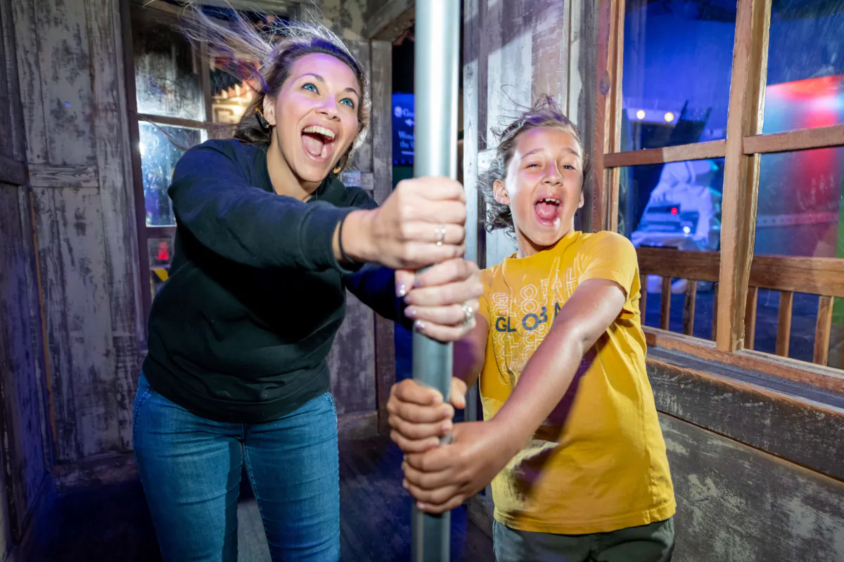 Visitors to WonderWorks in Branson, Missouri, try to withstand the force of a hurricane. (Photo courtesy of WonderWorks)