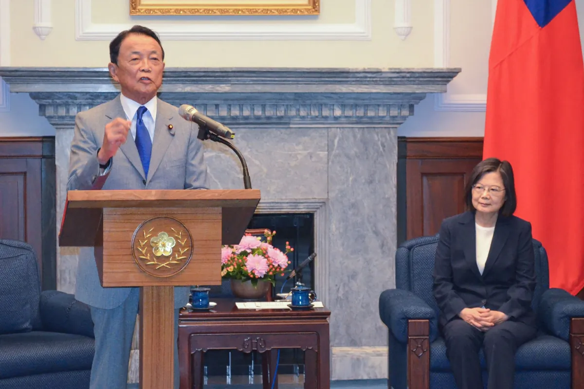 Former Japanese prime minister and current Liberal Democratic Party (LDP) vice president Taro Aso (L) speaks during his meeting with Taiwan's President Tsai Ing-wen (R) during his visit to Taipei on August 8, 2023. Aso warned a Taipei security forum on August 8 that the international community must "wake up" to the worsening situation surrounding the Taiwan Strait, a hotspot waterway separating the democratic island from China. (STR/JIJI Press/AFP via Getty Images)