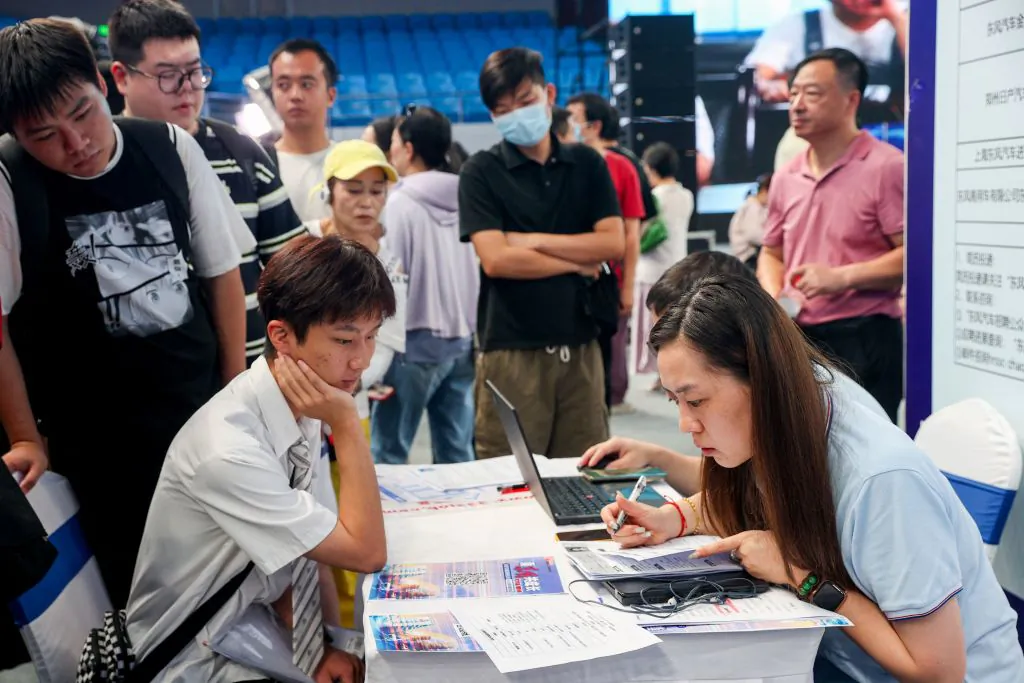 University graduates attend a job fair in Wuhan, in China's central Hubei Province, on Aug. 10, 2023. (TR/AFP via Getty Images)