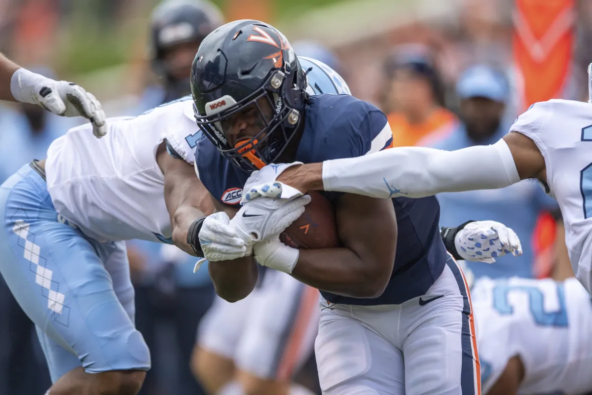 Virginia running back Mike Hollins (7) runs up the middle for a gain against North Carolina during the first half of an NCAA college football game, in Charlottesville, Va., on Nov. 5, 2022. (Mike Caudill/AP Photo)
