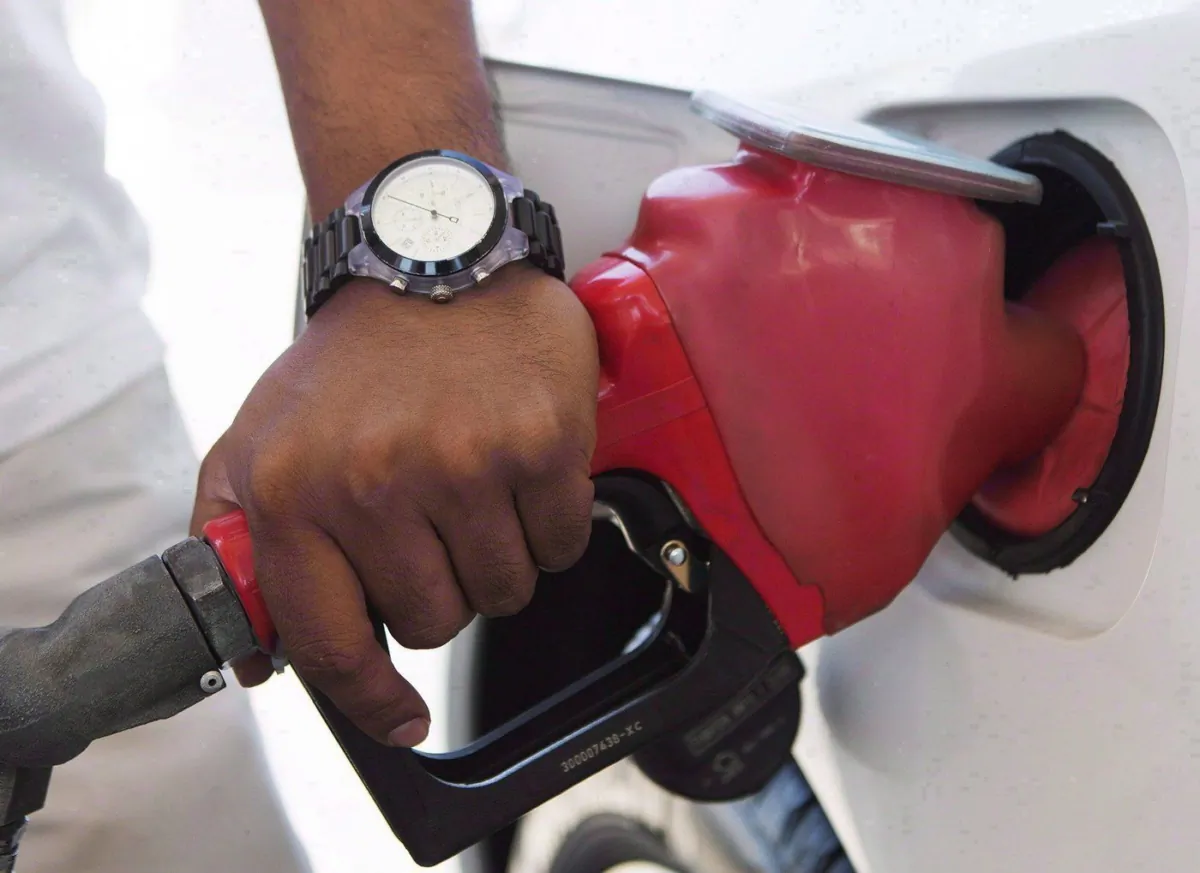 A person pumps fuel in Toronto, on Sep. 12, 2012. (The Canadian Press/Michelle Siu)
