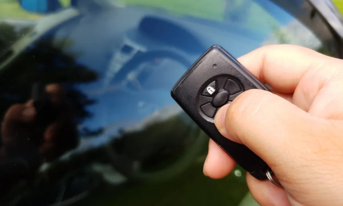 A motorist holds a keyless fob. (Lily Zhou/The Epoch Times) 