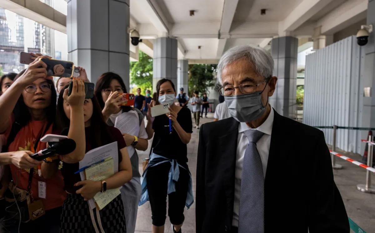 Martin Lee, (R), the founding chairman of the city’s Democratic Party, leaves high court in Hong Kong, on Aug. 14, 2023. (Louise Delmotte/AP Photo)