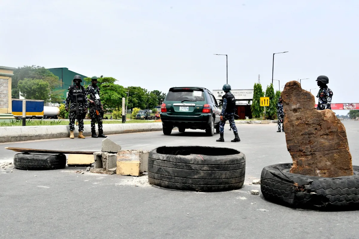 Police officers enforce a restriction imposed on motorists during local elections in Lagos, Nigeria, on March 18, 2023. (Pius Utomi Ekpei/AFP via Getty Images)