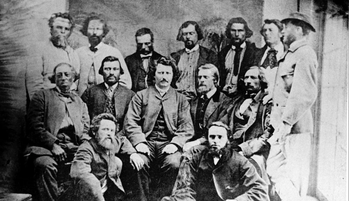W.B. O'Donoghue (seated 2-R) and Louis Riel (seated 3-R) along with Mr. Riel's councillors circa 1869–1870. (CP Photo)
