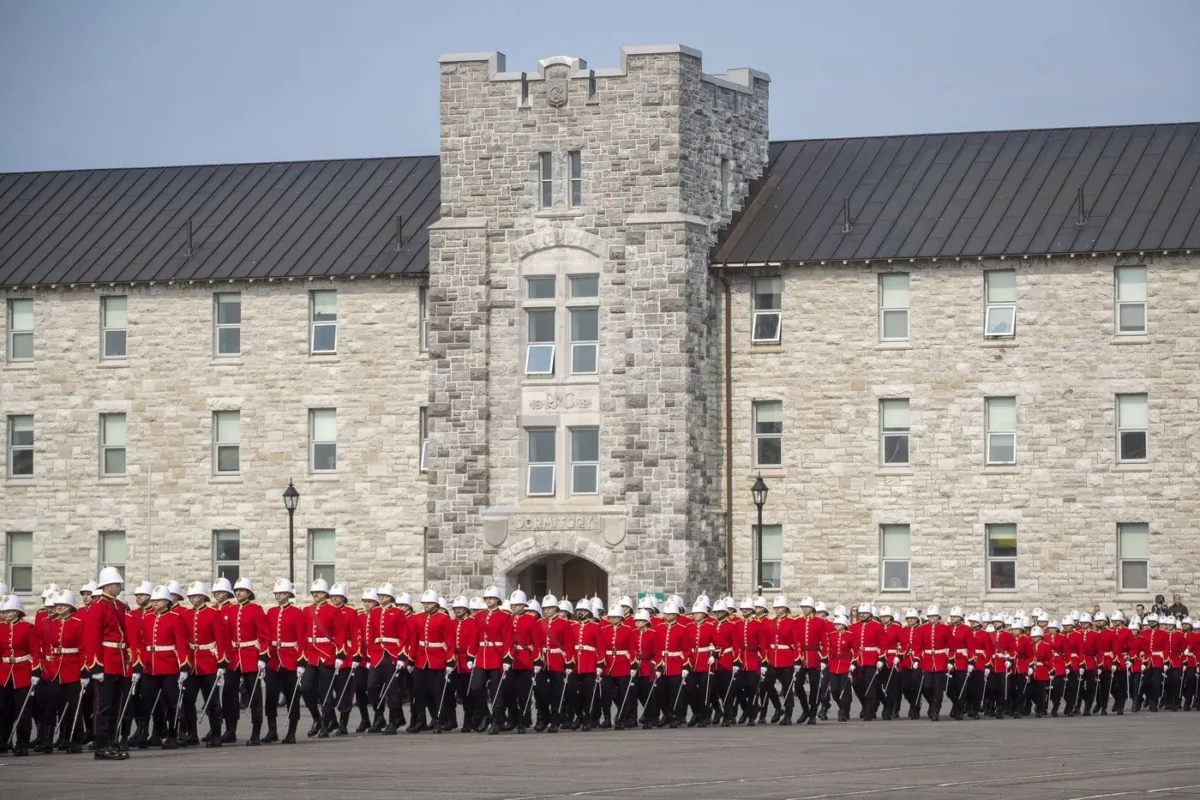 Officer cadets march on the parade square before the Royal Military College Commissioning Parade in Kingston, Ont., on May 19, 2023. (The Canadian Press/Lars Hagberg)