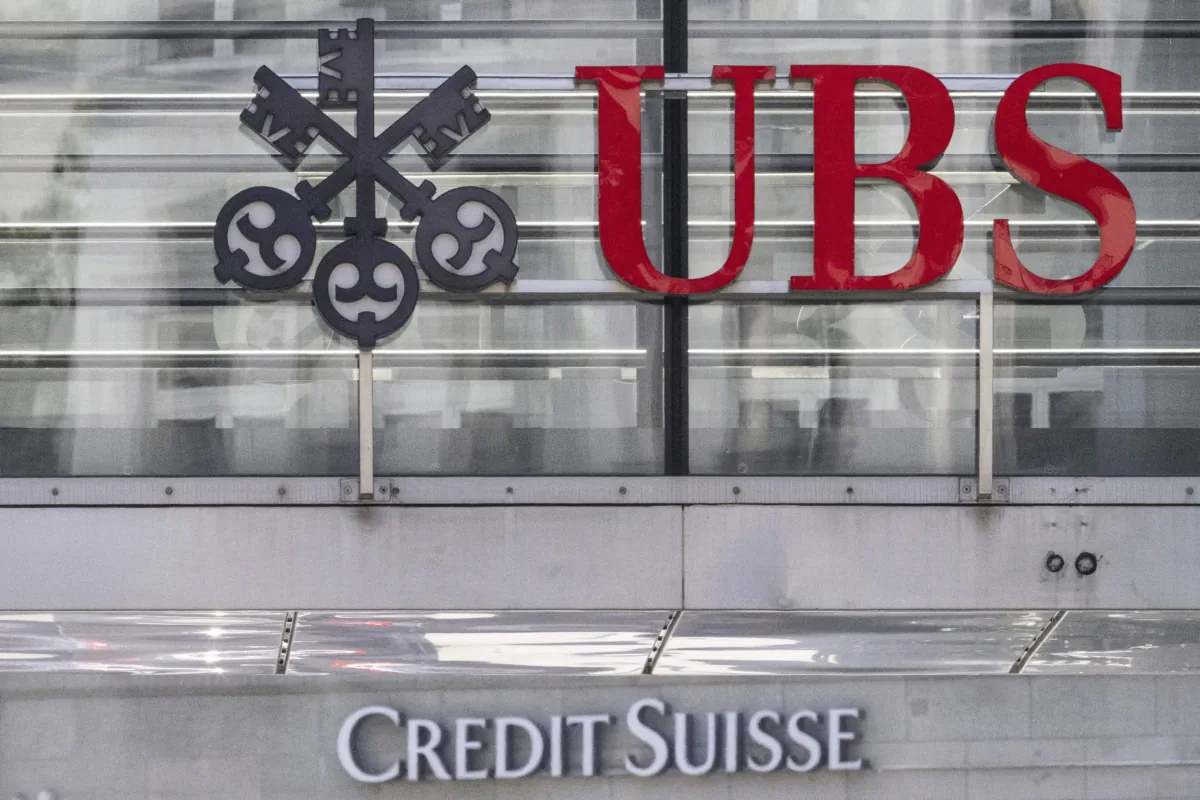 The logos of the Swiss banks Credit Suisse and UBS are pictured in Zurich on June 12, 2023. (Ennio Leanza/Keystone via AP)