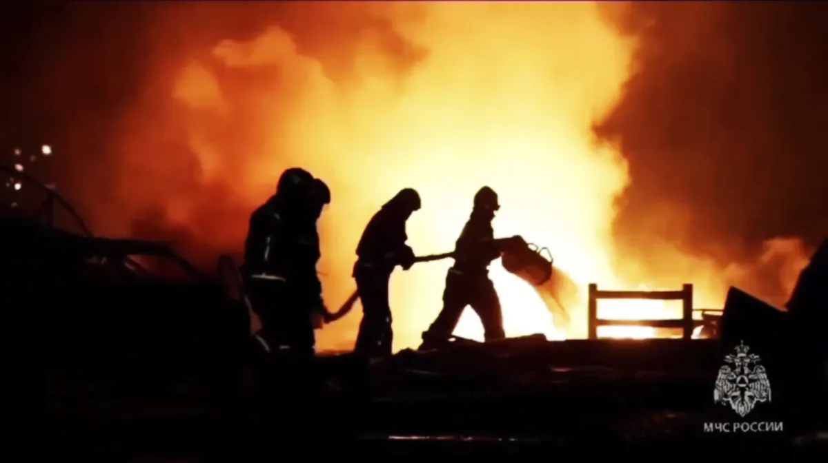 The firefighters work to extinguish a fire at a petrol station on a road near Makhachkala, the capital of Dagestan, Russia, on Aug. 14, 2023. (Ministry of Emergency Situations press service via AP)