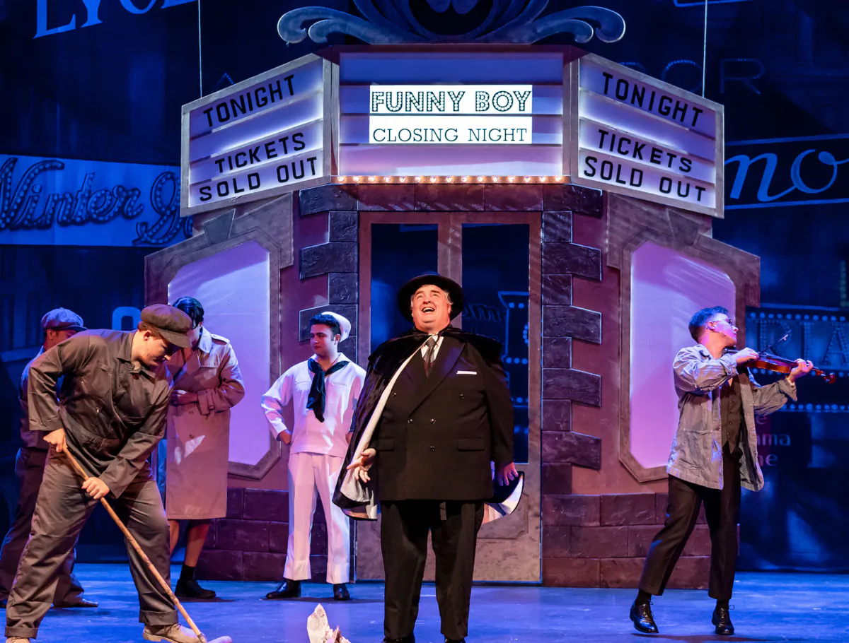 The opening scene of “The Producers: A Mel Brooks Musical” from Music Theater Works, as Max Biaylstock (Thomas M. Shea, C) presents his “Funny Boy,” an adaption of “Hamlet.” (Brett Beiner photography)