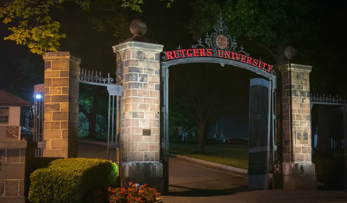 Night time view of gates to Rutgers University (Old Queens Campus) in New Brunswick, N.J., on July 30, 2018. (Benjamin Clapp/Shutterstock)
