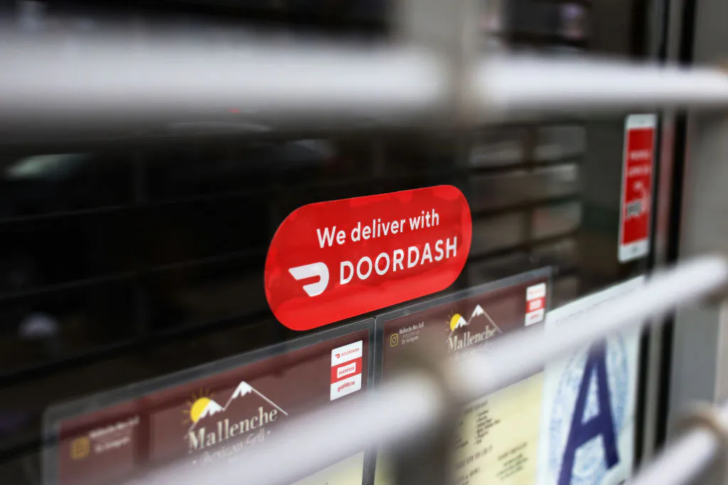 A DoorDash sticker is seen on a window at Mallenche Mexican Grill in the Flatbush neighborhood of Brooklyn in New York City on Dec. 4, 2020. (Michael M. Santiago/Getty Images)