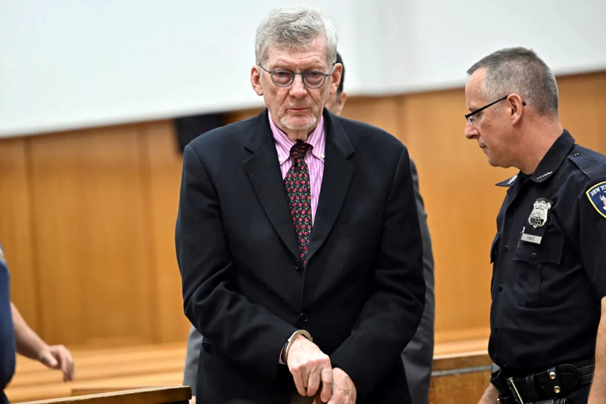 Lawrence Gray (C), a retired political science professor, is handcuffed was he appears at his arraignment in Manhattan criminal court in New York on Aug. 15, 2023. (Curtis Means/Daily Mail via AP)