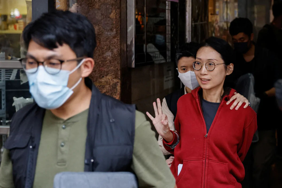 Pro-democracy activist Bobo Yip is taken away by police in Hong Kong on Aug. 10, 2023. (Tyrone Siu/Reuters)