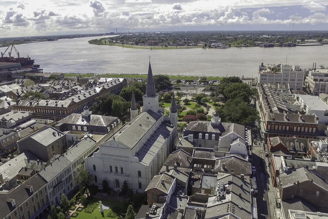 An overhead view taken by a drone provides context to St. Louis Cathedral’s size and location. Even in modernity, the circa-1851 structure surpasses the surrounding buildings of the historic French Quarter. It sits in a crescent of the mighty Mississippi River and is located in the same place that Catholic churches have occupied for more than 300 years. (Courtesy of the Archdiocese of New Orleans)