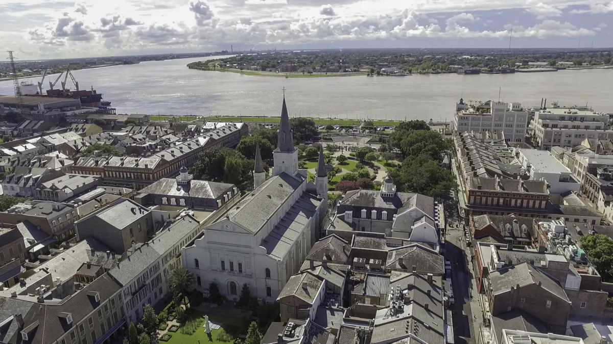 An overhead view taken by a drone provides context to St. Louis Cathedral’s size and location. Even in modernity, the circa-1851 structure surpasses the surrounding buildings of the historic French Quarter. It sits in a crescent of the mighty Mississippi River and is located in the same place that Catholic churches have occupied for more than 300 years. (Courtesy of the Archdiocese of New Orleans)
