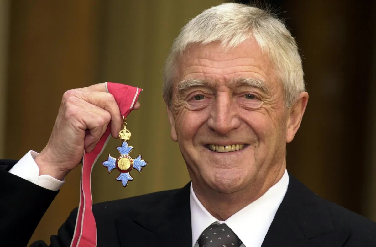 Michael Parkinson receiving a CBE at Buckingham Palace in London on Nov. 24, 2000. (Kirsty Wigglesworth/PA)