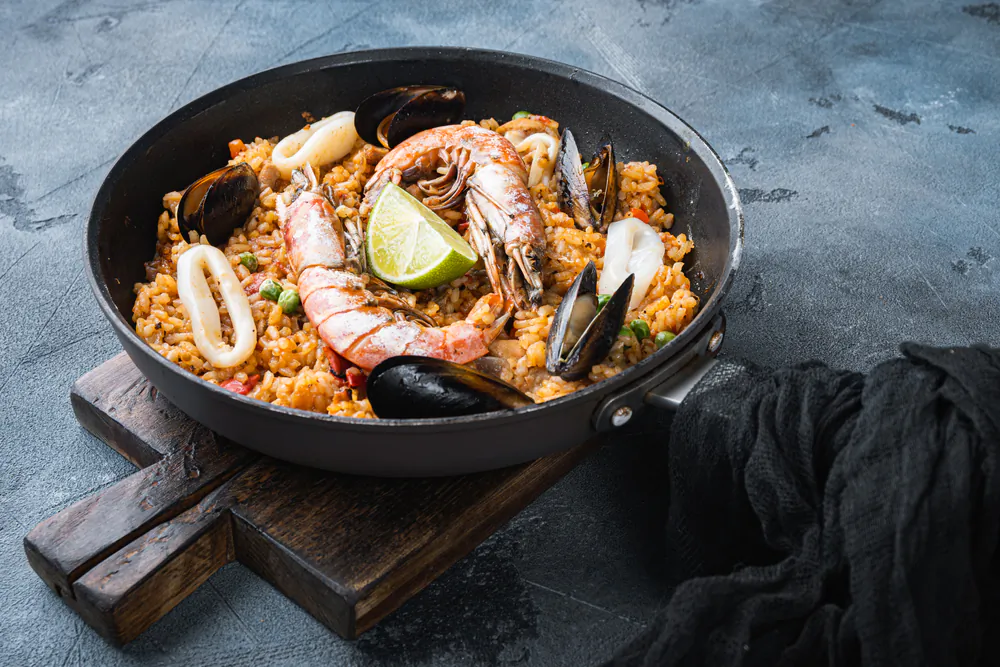 A paella might sound intimidating, but it's easy to make with the right ingredients and by following a few important steps. (Ilia Nesolenyi/Shutterstock)