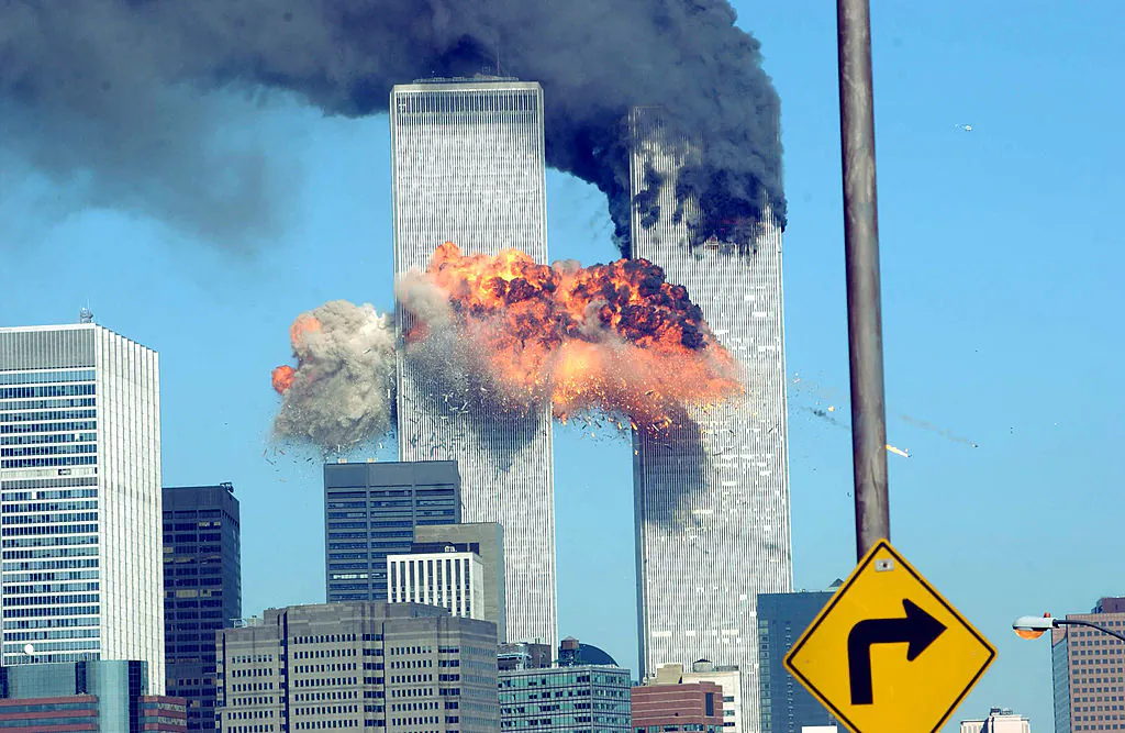 A fiery blasts rocks the World Trade Center after being hit by two planes, in New York City, on Sept. 11, 2001. (Spencer Platt/Getty Images)