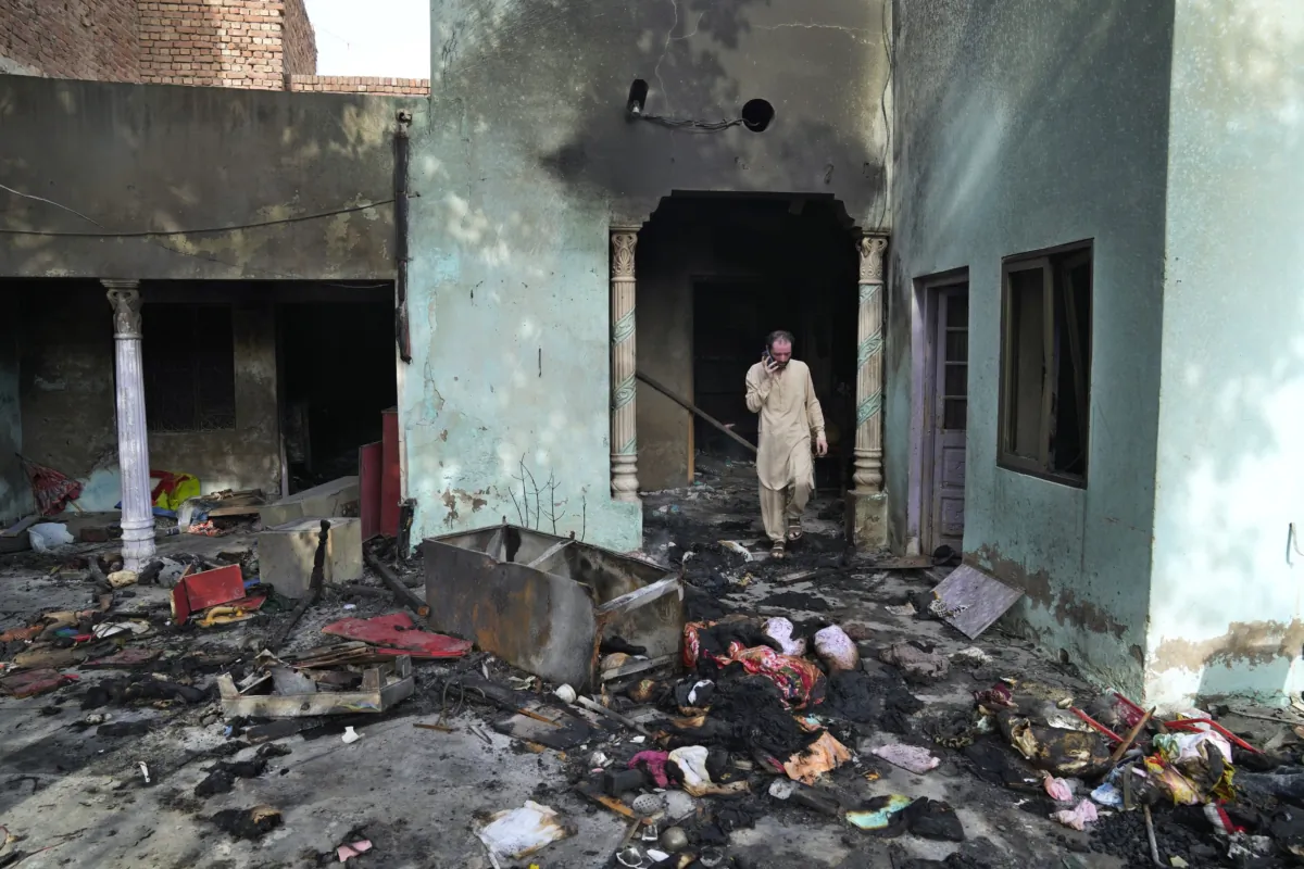 A Christian man looks at a home vandalized by an angry Muslim mob in Jaranwala in the Faisalabad district, Pakistan, on Aug. 17, 2023. (K.M. Chaudary/AP Photo)