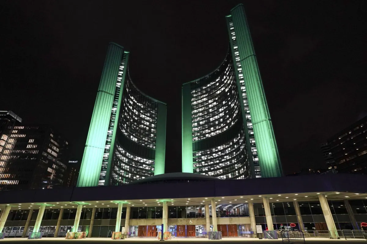 City Hall is illuminated at night in downtown Toronto on Friday, Feb. 10, 2023. (The Canadian Press/Arlyn McAdorey)
