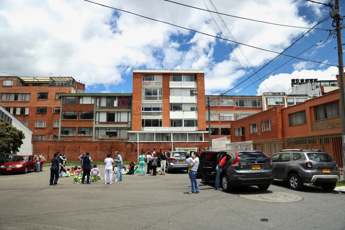 People stand on a street after a strong earthquake shook Colombian capital Bogota, prompting evacuations of offices and restaurants in Bogota, Colombia, on Aug. 17, 2023. (Luisa Gonzalez/Reuters)