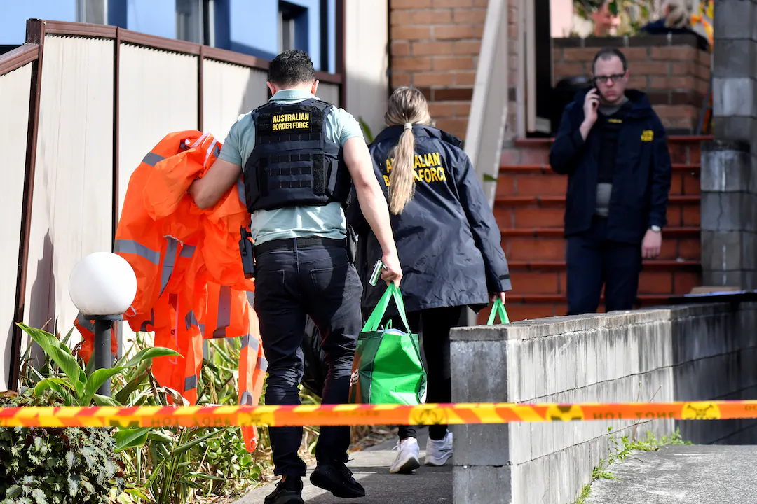 Australian Border Fore (ABF) officers are seen onsite after an unit was raided on Kelsey St in the suburb of Arncliffe in Sydney, Australia on Aug. 17, 2023. (AAP Image/Bianca De Marchi)