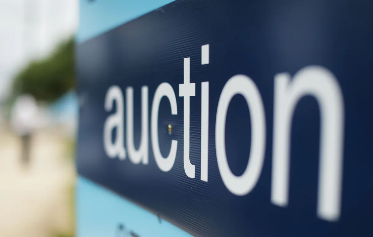 An auction sign stands on display in Blacktown, Australia, on Feb. 14, 2015. (Mark Metcalfe/Getty Images)