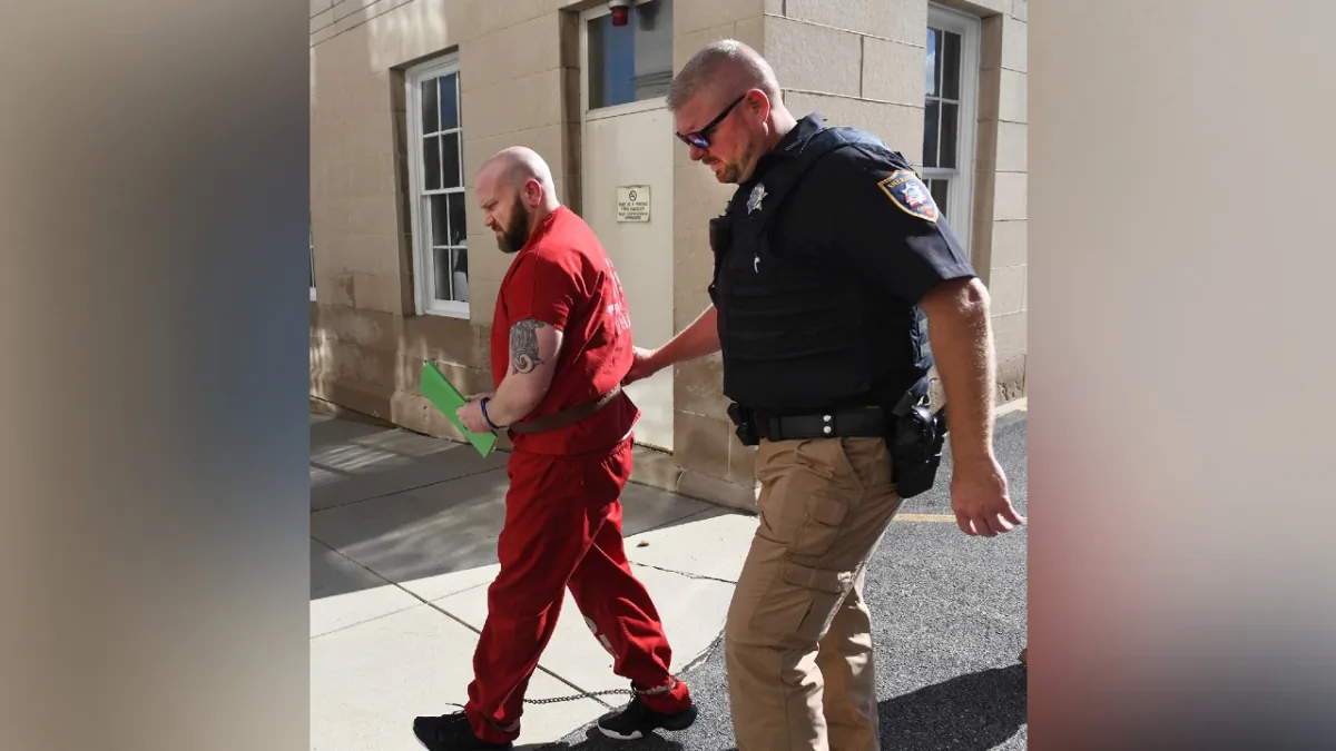 Ex Somerset County D.A. Jeffrey Thomas is escorted to his assault hearing at Somerset County courthouse on Aug. 17, 2023. (Todd Berkey/The Tribune-Democrat via AP)