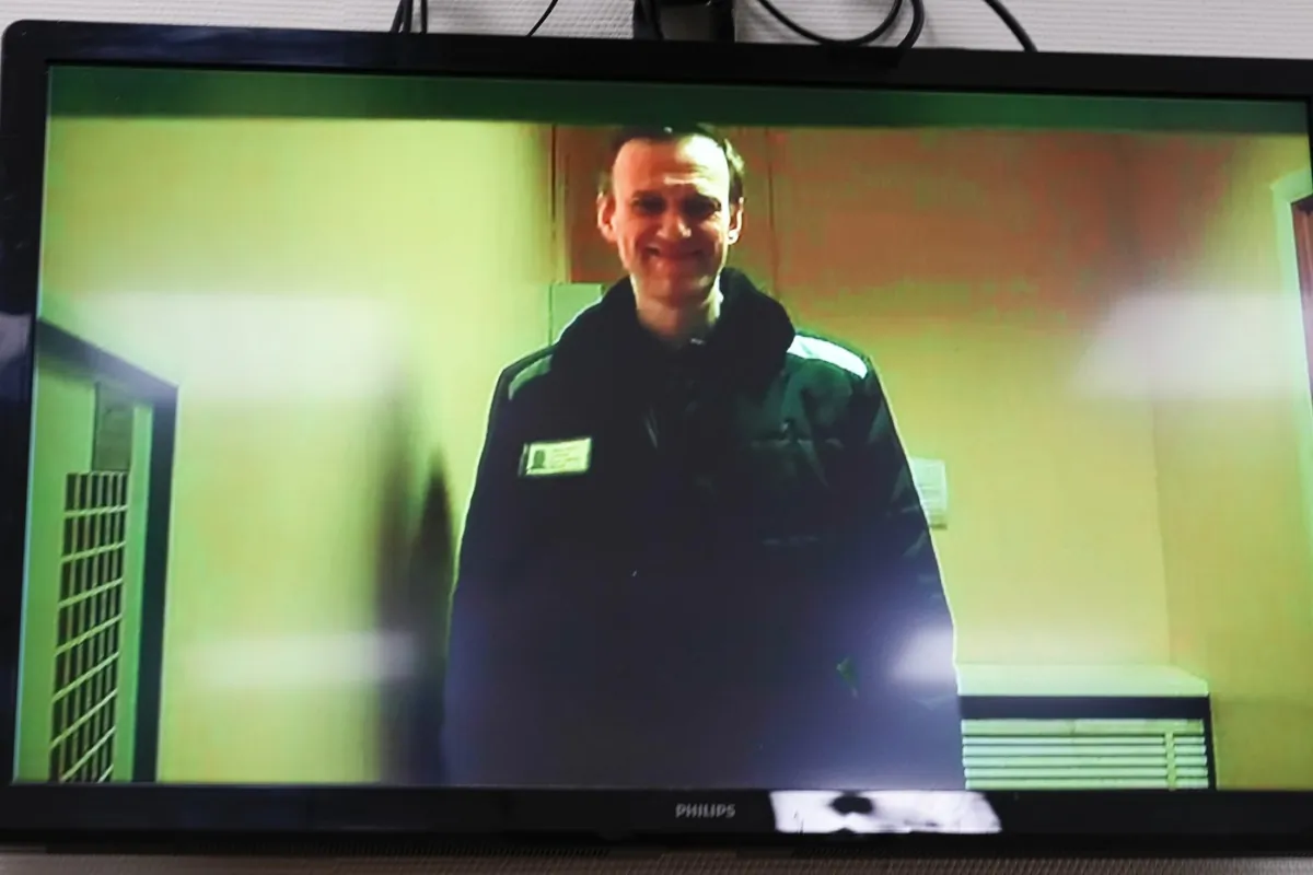 Russian opposition leader Alexei Navalny is seen on a TV screen, as he appears in a video link April 26, 2023. (The Canadian Press/AP-Alexander Zemlianichenko)