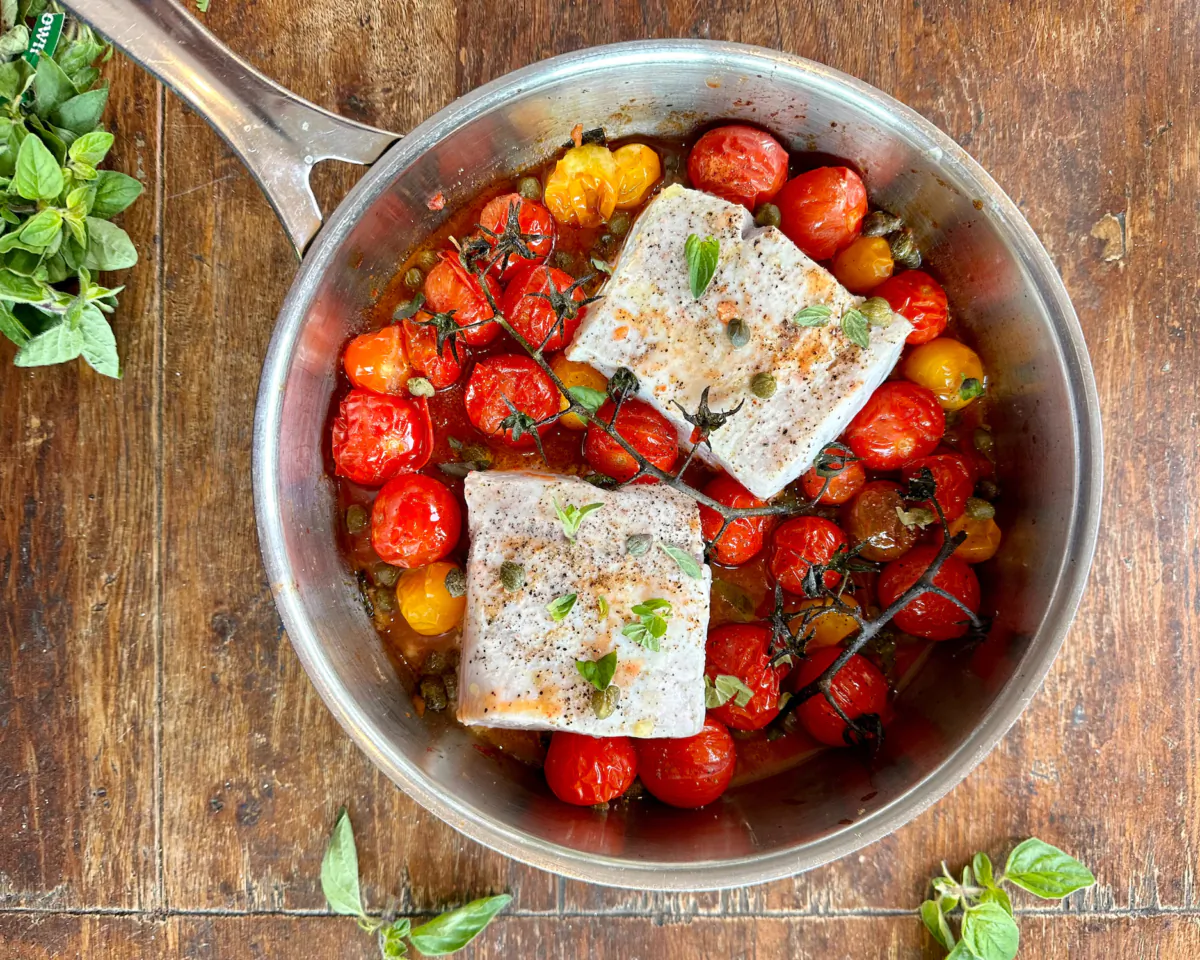 These whitefish fillets are roasted in a light sauce that starts with blistered tomatoes. (Lynda Balslev for Tastefood)