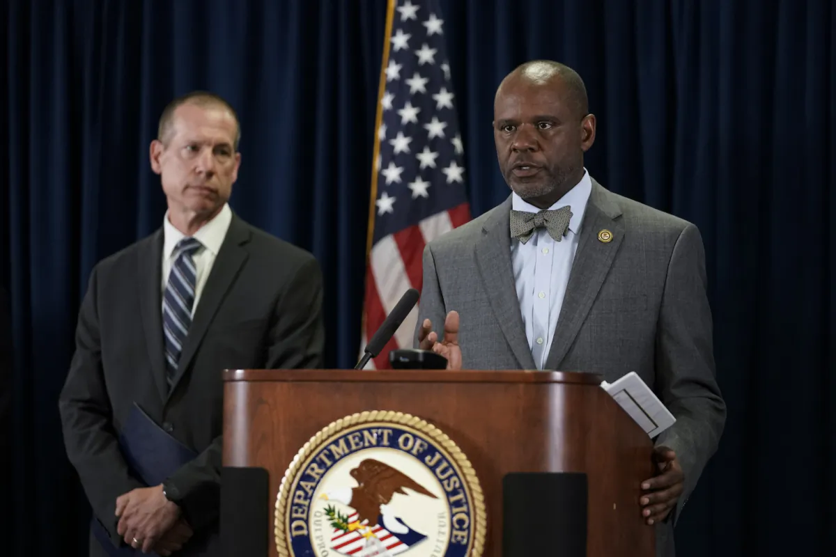 U.S. Attorney for the Northern District of California Ismail J. Ramsey, right, speaks to reporters during a press conference to announce federal authorities have charged 9 current and former Northern California police officers in a corruption investigation in San Francisco on Aug. 17, 2023. (Godofredo A. Vásquez/AP Photo)