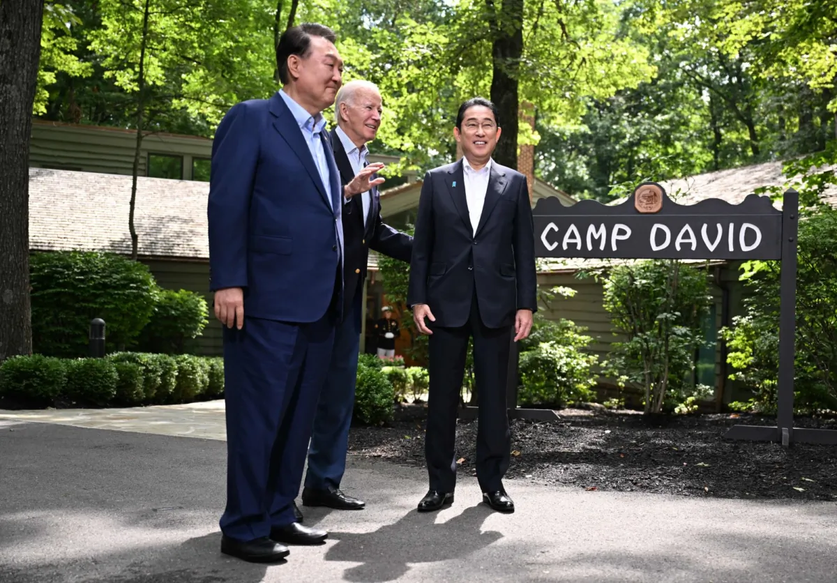 U.S. President Joe Biden (C) welcomes Japanese Prime Minister Fumio Kishida (R), and South Korean President Yoon Suk Yeol to Camp David, Md., for a Trilateral Summit on Aug. 18, 2023. (Jim Watson/AFP via Getty Images)