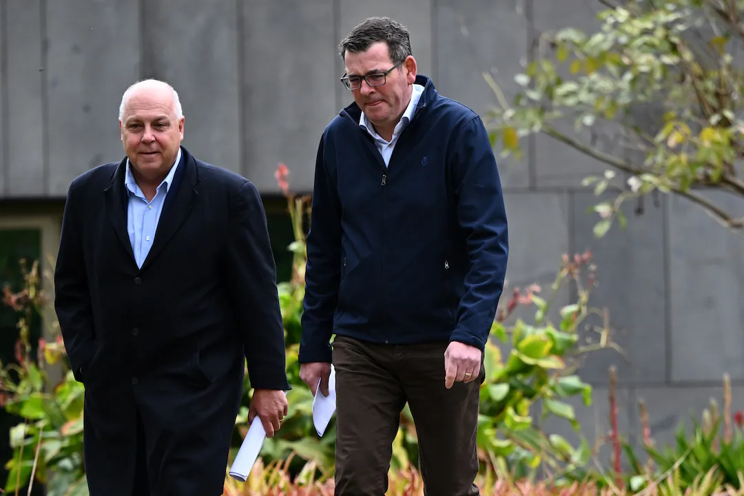 Victorian Treasurer Tim Pallas (L) and Victorian Premier Daniel Andrews  (R) arrive to speak during a press conference in Melbourne, Australia on Aug. 19, 2023. (AAP Image/Joel Carrett)