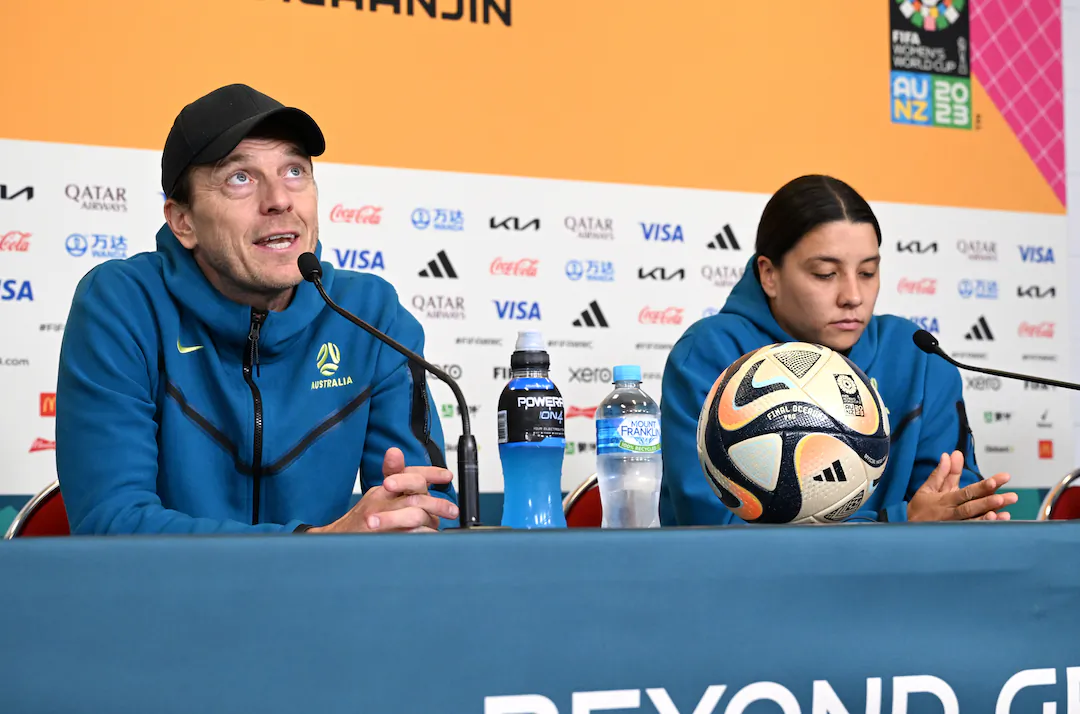 Australian coach Tony Gustavsson (L) and Sam Kerr (R) of Australia are seen during an Australian team press conference ahead of their World Cup third place play off match against Sweden on Aug. 19, at Brisbane Stadium in Brisbane, Australia on Aug. 18, 2023. (AAP Image/Darren England)