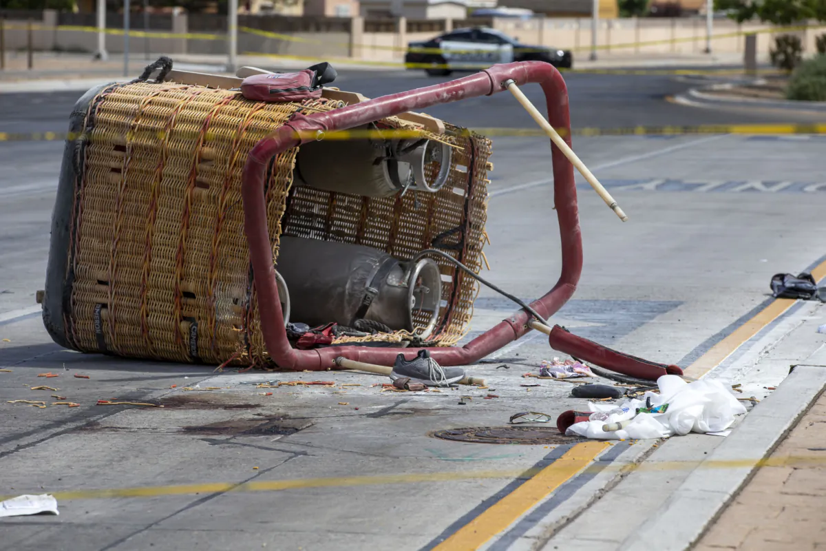 The basket of a hot air balloon lies on the pavement after a crash landing in Albuquerque, N.M., on June 26, 2021. (Andres Leighton/AP Photo)