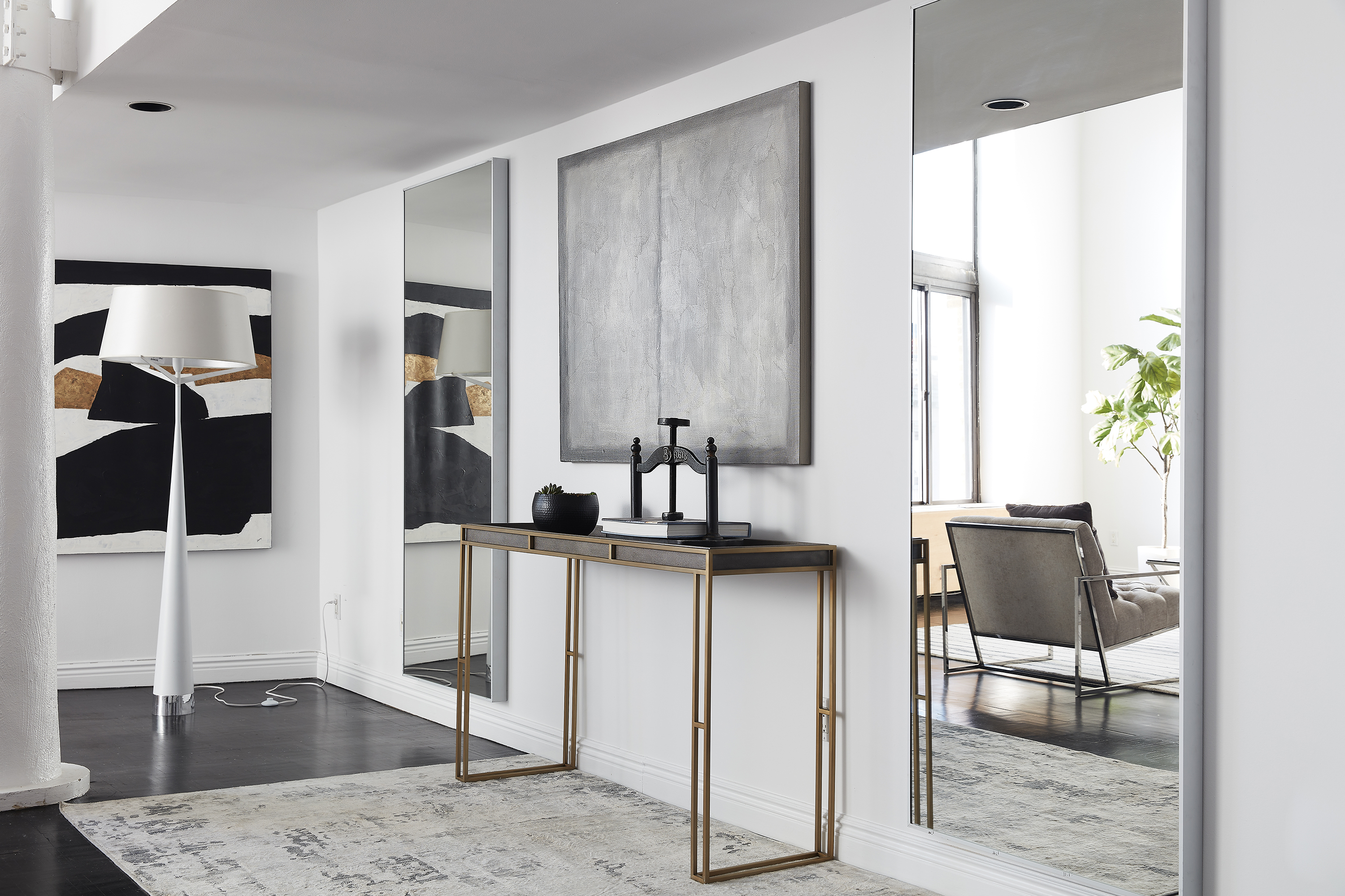 Mirrors and artwork are paired to create a sense of color and balance.